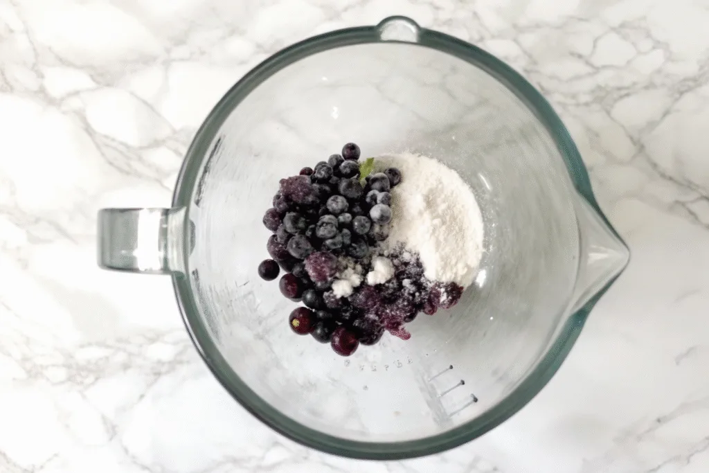 Blending blueberries and cottage cheese for ice cream